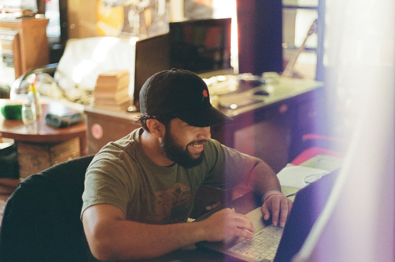 A contractor at his desk indoors, focused, the seat where website investment decisions actually get made.