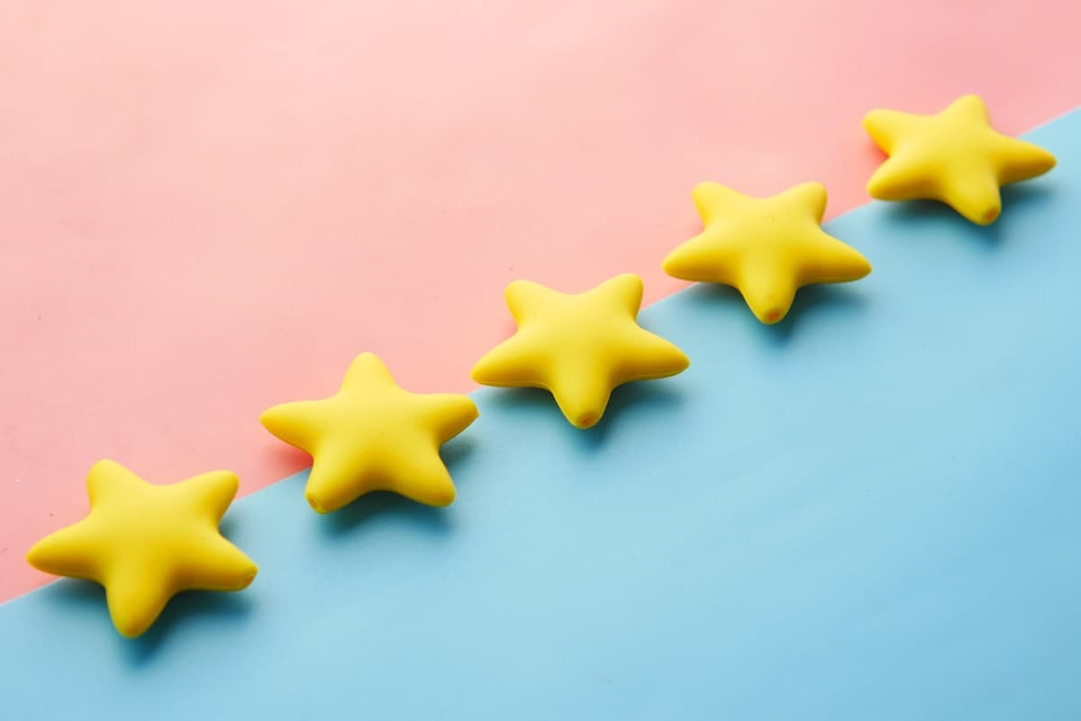 A row of five gold review stars representing the social proof homeowners look for before they call.