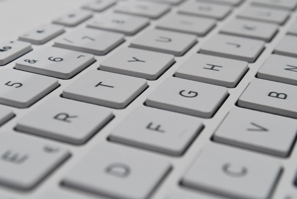 A close-up of fingers on a keyboard, the on-page SEO work that turns a website into a local ranking machine.